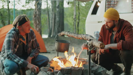 Young-Men-Talking-by-Campfire